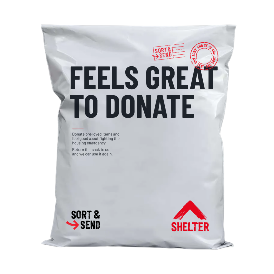 A white flat mailer bag with printed text reading 'FEELS GREAT TO DONATE' in large black letters, plus red and black 'SORT & SEND' and 'SHELTER' branding, photographed on a plain white background.