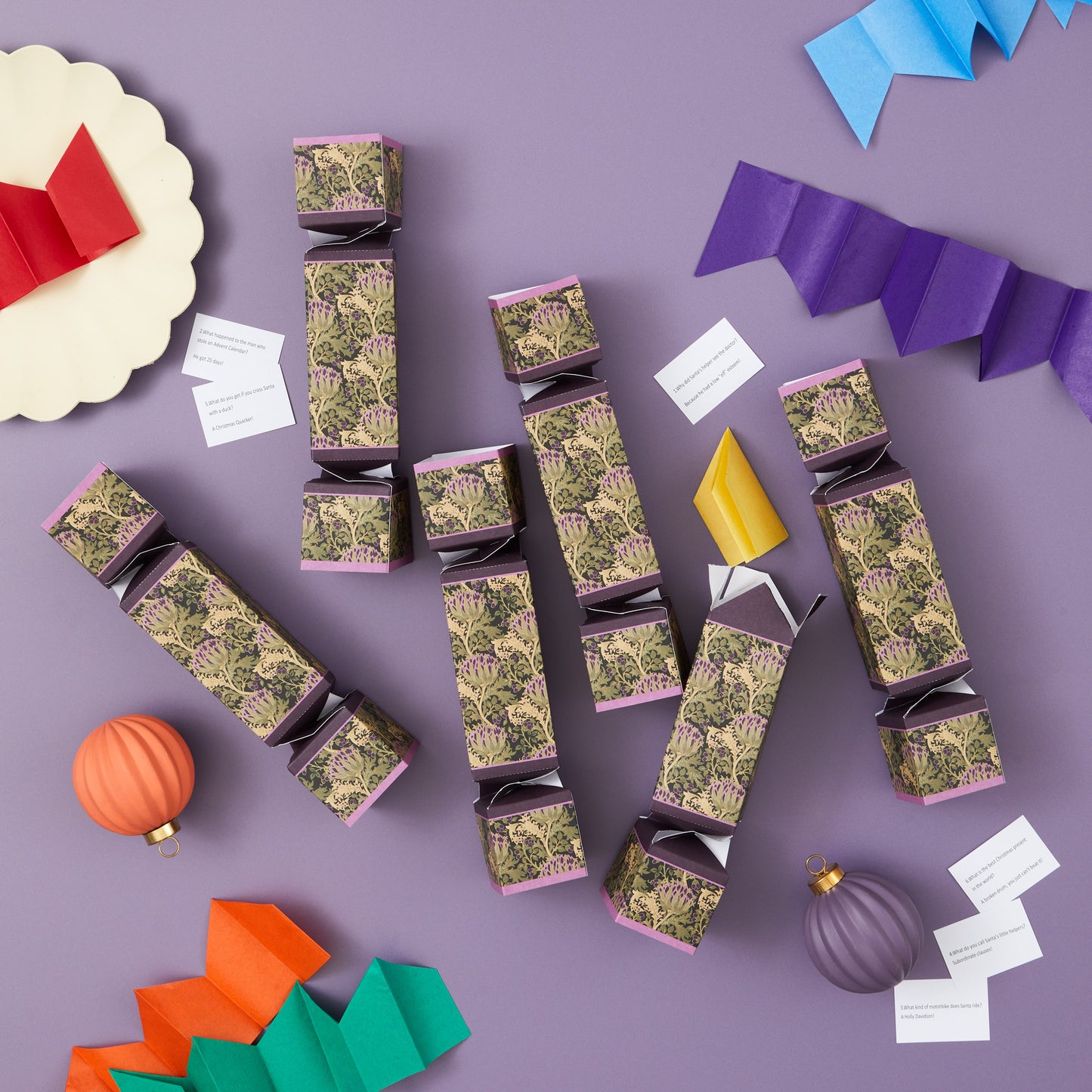 Decorative cracker with green pattern on a purple background