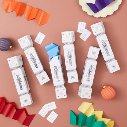 Decorative cracker boxes with Christmas-themed illustrations on a brown background