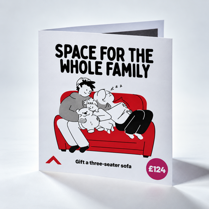 A folded greeting card or gift card shown standing open on a white background. The front features the text 'SPACE FOR THE WHOLE FAMILY' above a cartoon family hugging on a red sofa, with 'Gift a three-seater sofa' and a price '£124' printed below.