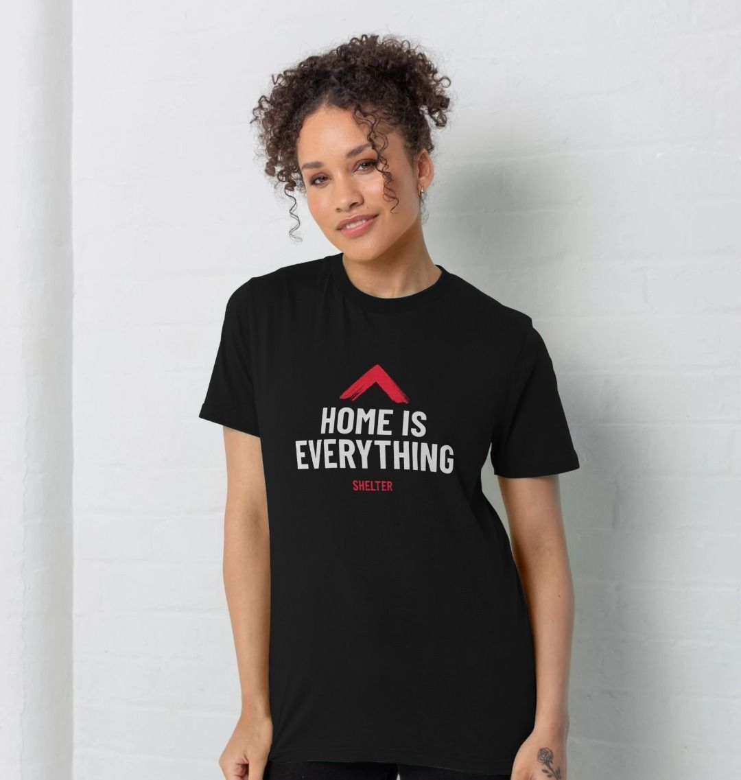 Woman wearing black ' Home is Everything' T Shirt