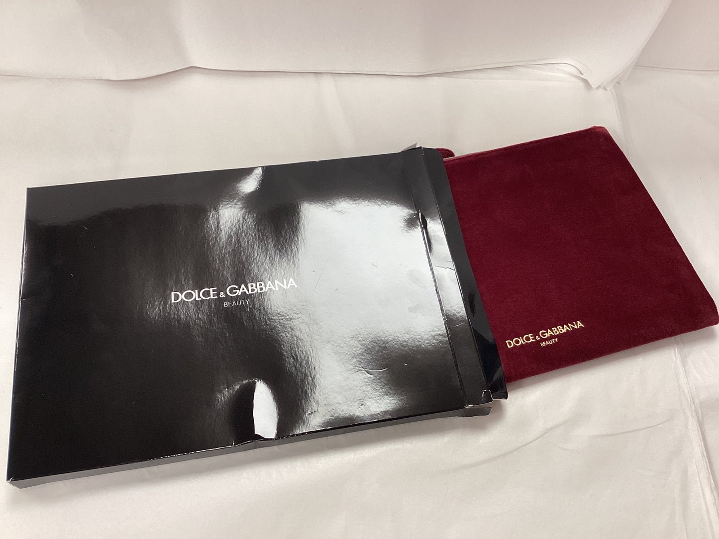Dolce and Gabbana new cosmetic bag burgundy with black box