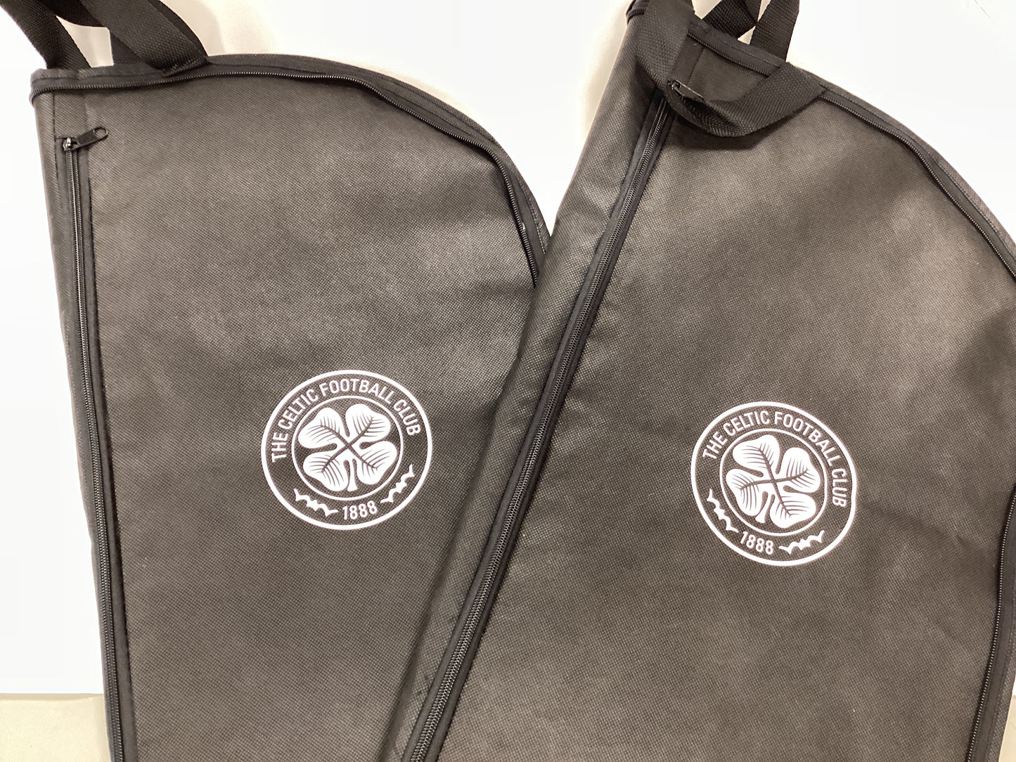 Celtic Hospitality Gifts from Celtic FC vs Livingston FC Match 11/02/2026. 2x Programmes, 2x Suit Carriers, 1x Laptop Bag, 1x Menu