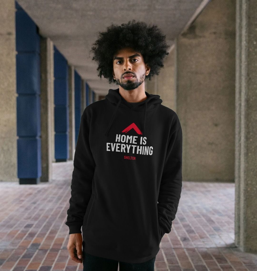 Man wearing black 'Home is Everything' hoodie