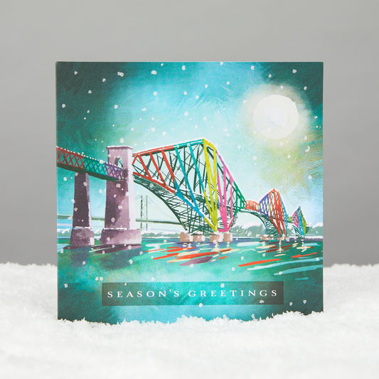 square card of a moonlit forth bridge reads seasons greetings