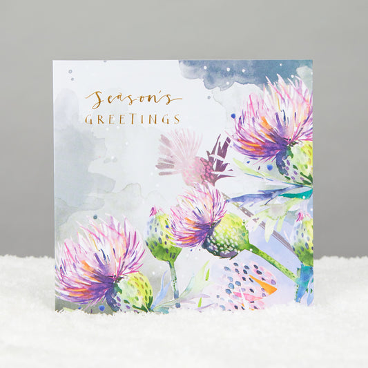 watercolour style thistles on square card with the message season's greetings